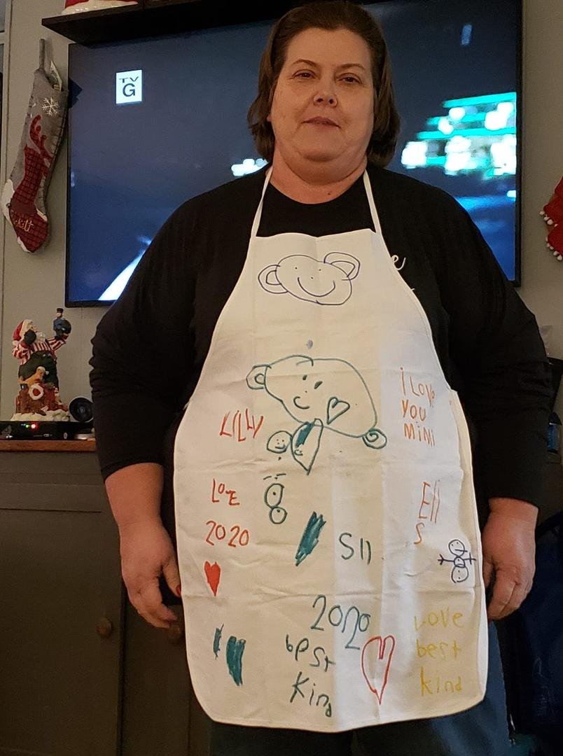 Mimi got her new apron on. Designed by Lilly and Eli...