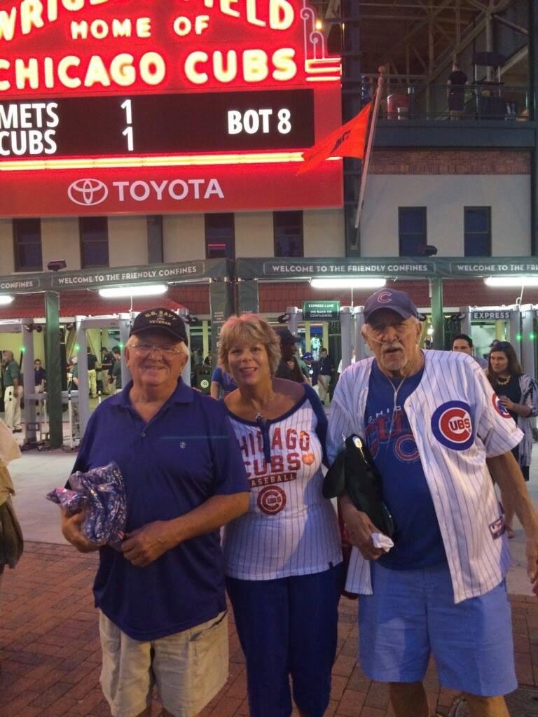 Cubs game great time with neighbor.