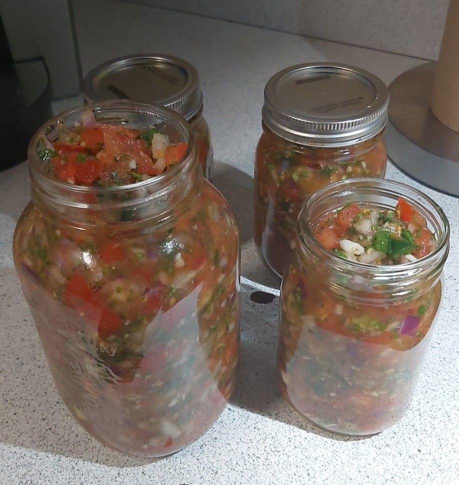 Pico de gallo- fresh vegetables-tomatoes, cilantro, jalapeños, red and white onion, garlic, lime juice, cumin and chili powder, now it sits for 24 hours,