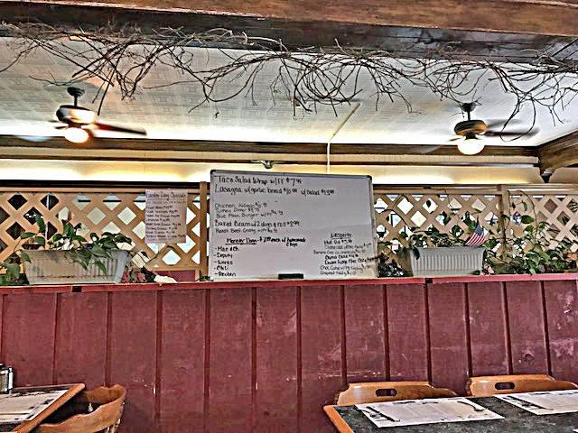 Having club sandwiches at the Wilderness Lounge and Restaurant. We are not sure what the old sticks are for. Our  waitress doesn't know either. I thought, being Easter and all, they might represent a crown of thorns, but no