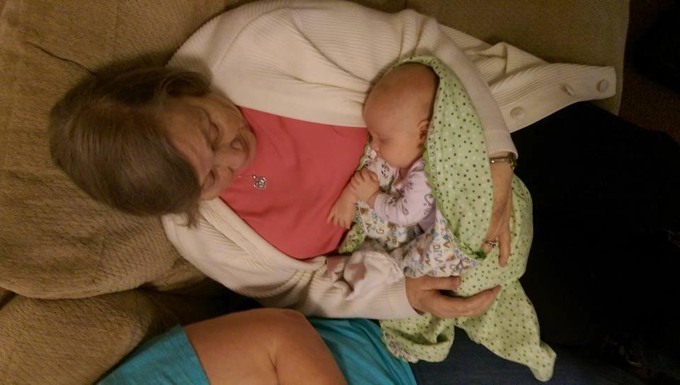 great grandmother Phillips (aka GiGi) holding Marley.