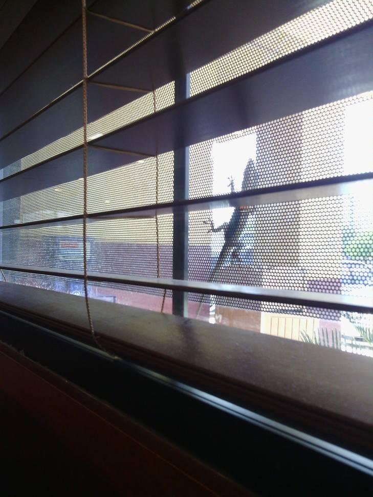 Look an insurance salesman peeking in the window