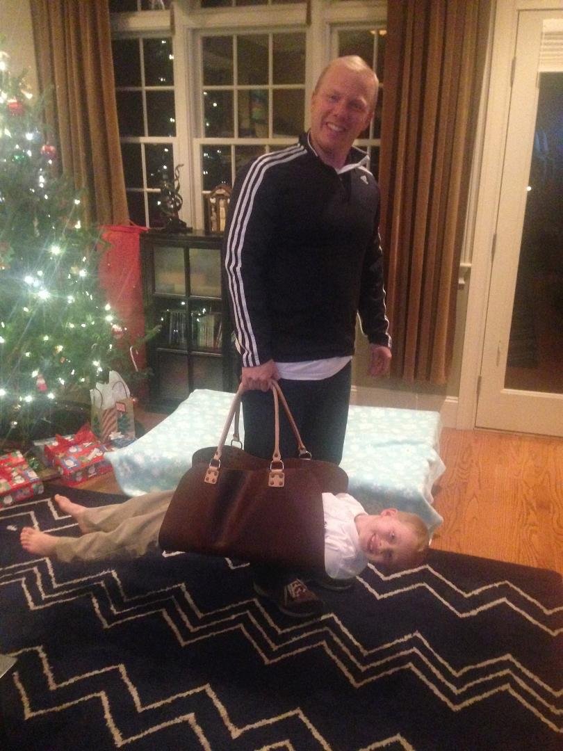 Son in law, Mike, his new firewood carrier, and Ethan . . . a "chip off the old block!"