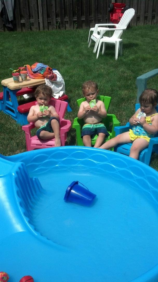 A relaxing afternoon by the pool.  It's really great to be two years old.