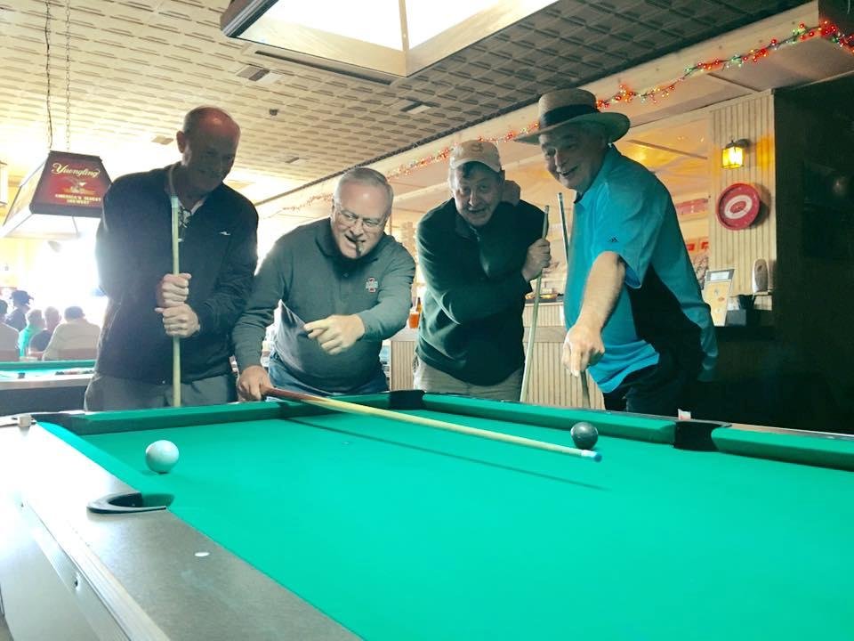 Playing pool in Dade city Florida. The girls are at the kumquat festival while the boys are trying to best each other. The underdogs Ed and Bob won!