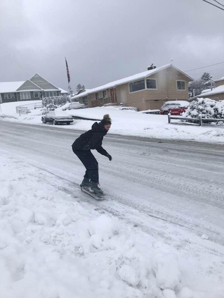 Yesterday, Raelyn snow skating down the street