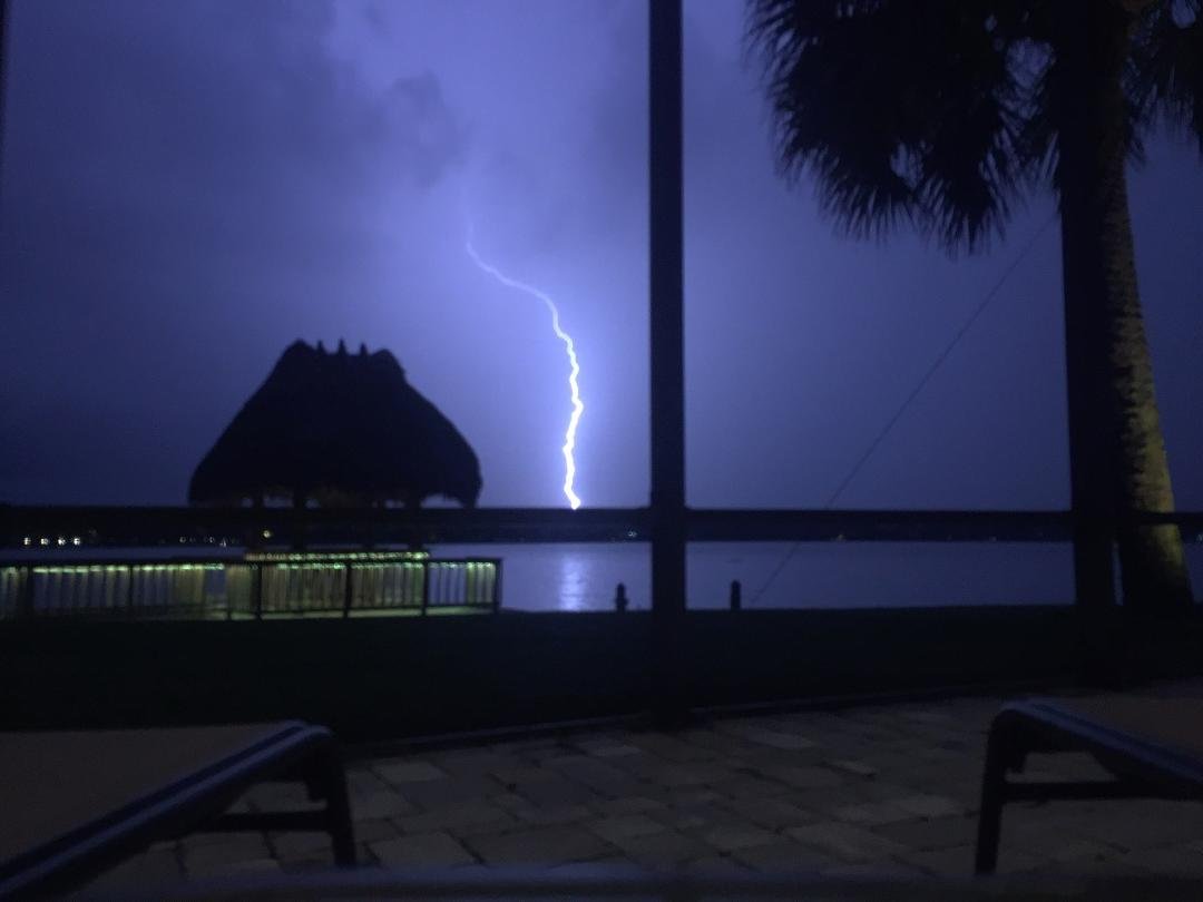Sitting at our friends Tom and Carolyn Connolly's lanai and caught this lightning strike that looks like it is hitting our house! 😮