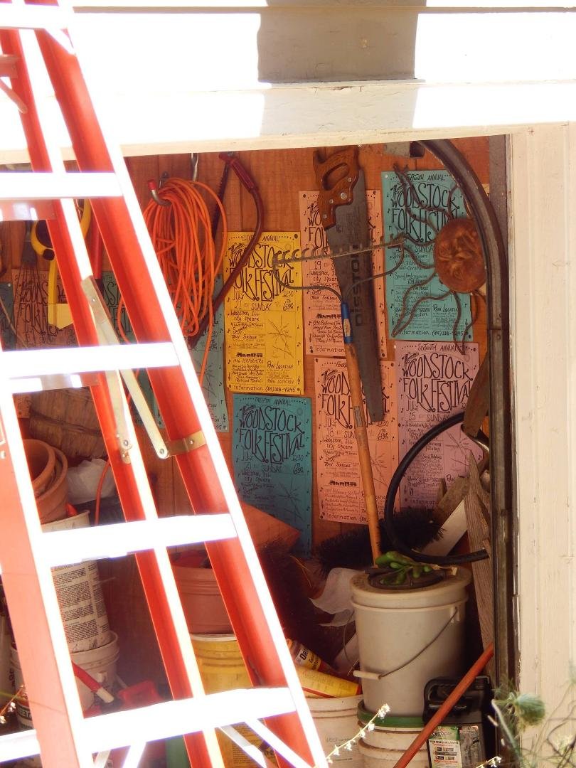 Garage decorations. Posters are the original Woodstock Folk Festival hand-drawn posters Amy used to make before we went to computer created artwork.