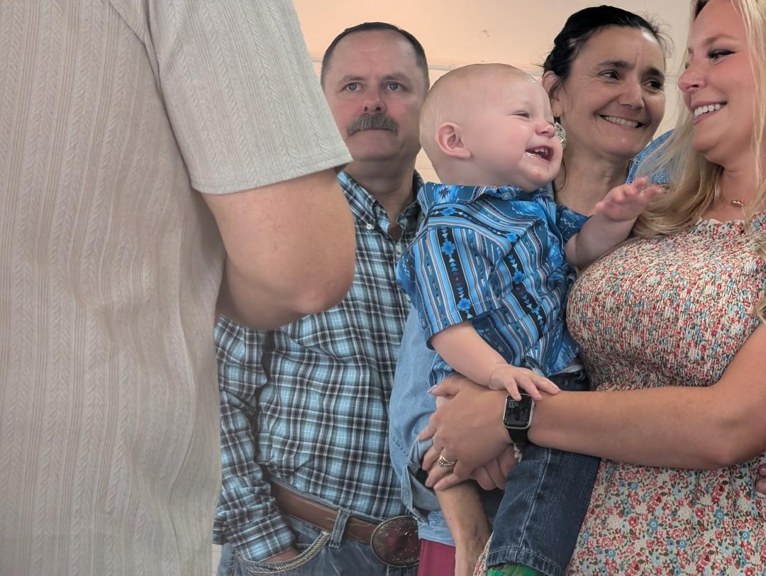 This is my great grand baby, his mother and grandparents. He was dedicated this morning. What a joyful child