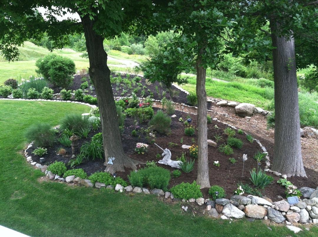 This is our serenity garden that we share with our neighbors. Debbi is the gardener and I'm the financial consultant. Except for real heavy lifting, I do a lot of "heavy looking on! What a country....What a wife!
