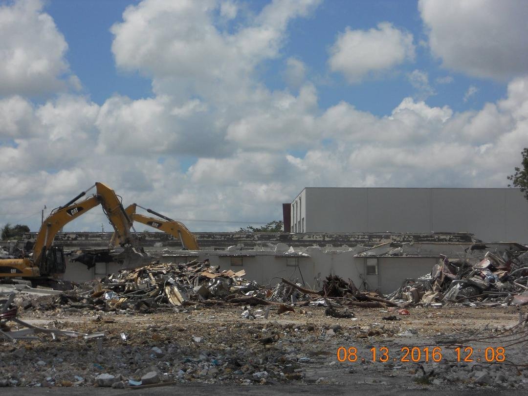 The backhoes doing more destruction to our old Viking ship. The library wing is biting the dust, or shall I say, heading to Valhalla.
