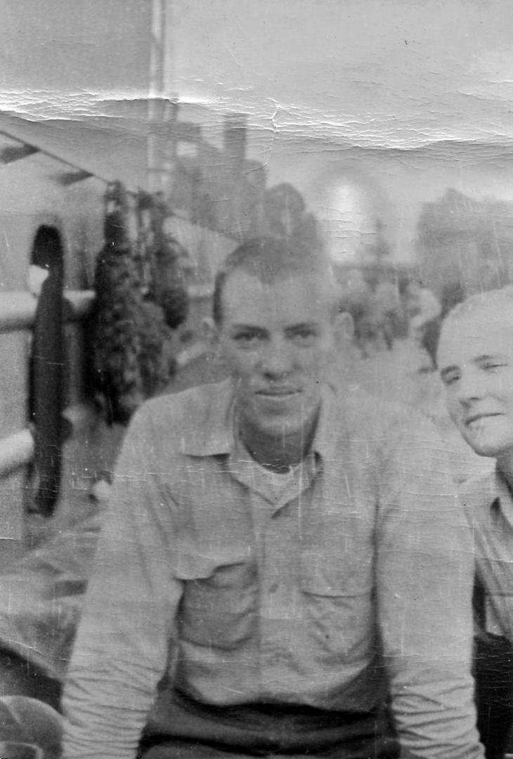 LTJG Navy his ship is in the background LSM 334