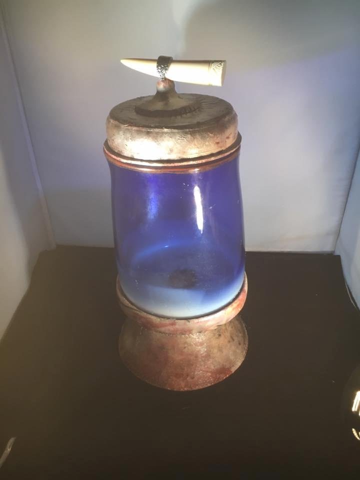 Here a new form! Ceramic ferris chloride surface with blue glass. Lid has a bone handle. Held in place by silver handle from spoon.