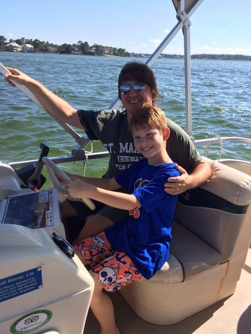 Greg and Connor. Cruising Destin harbor.