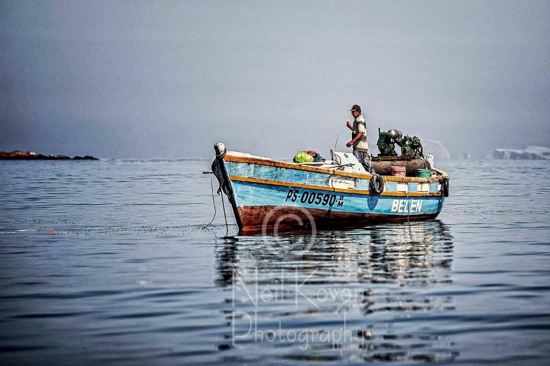 fisherman in San Miguel harbour in Pisco, Peru