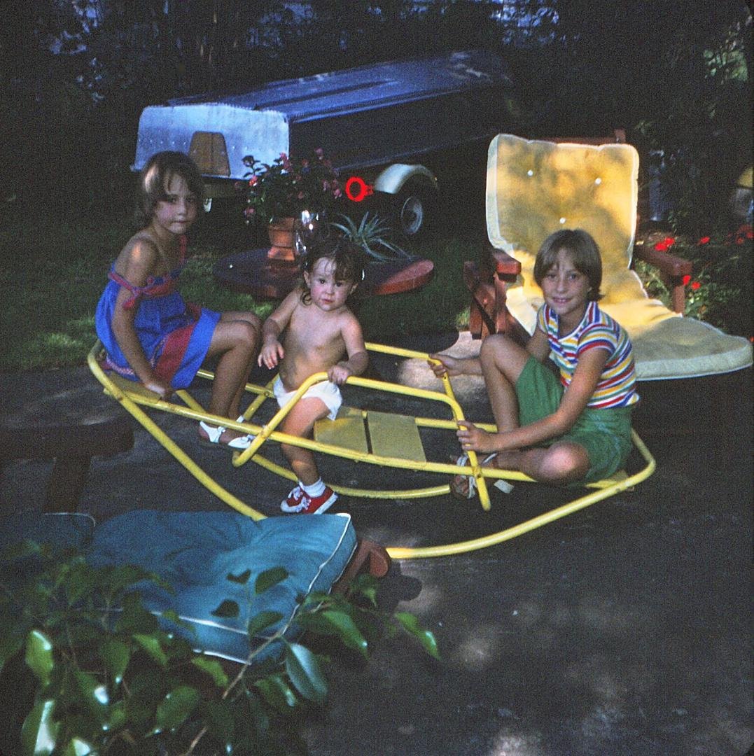 Here's a fun photo of Erica as a toddler and cousins - The old teeter-totter at 312 Washington Street, Westfield NJ. Cousins Krissy and Whitney are helping balance. Summers in Jersey were families sweating on the redwood c