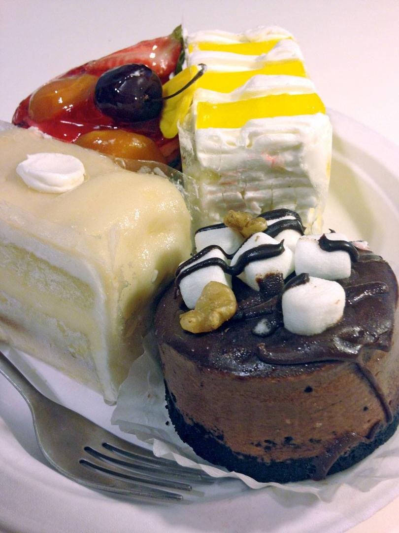 We're so lucky to have a next door neighbor, Leo, that works at a premo pastry shop Fantasy Cakes and Fine Pastries 'cause he'll bring by the days extras - yum!