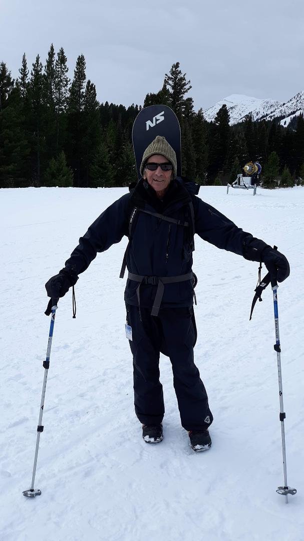 Hiking the mountain to go snowboarding today. Great day, yeeha!