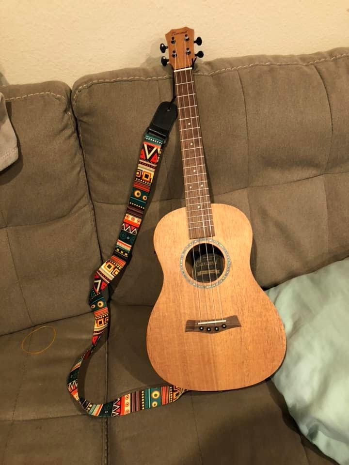 My new baritone ukulele!!!! Very exciting!!!! It is tuned like a guitar but inly has 4 strings. Most excited because I can already play it!!!! One happy girl!!!!