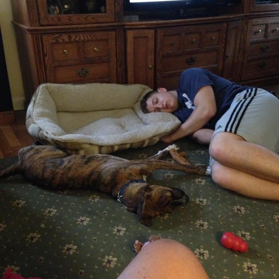 This is what two of my boys do on a day off. Look who's in the dog bed!