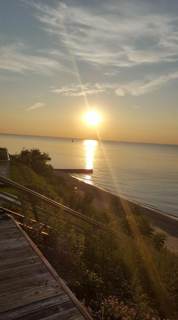 Just having a moment on the deck watching a sailboat in the distance.