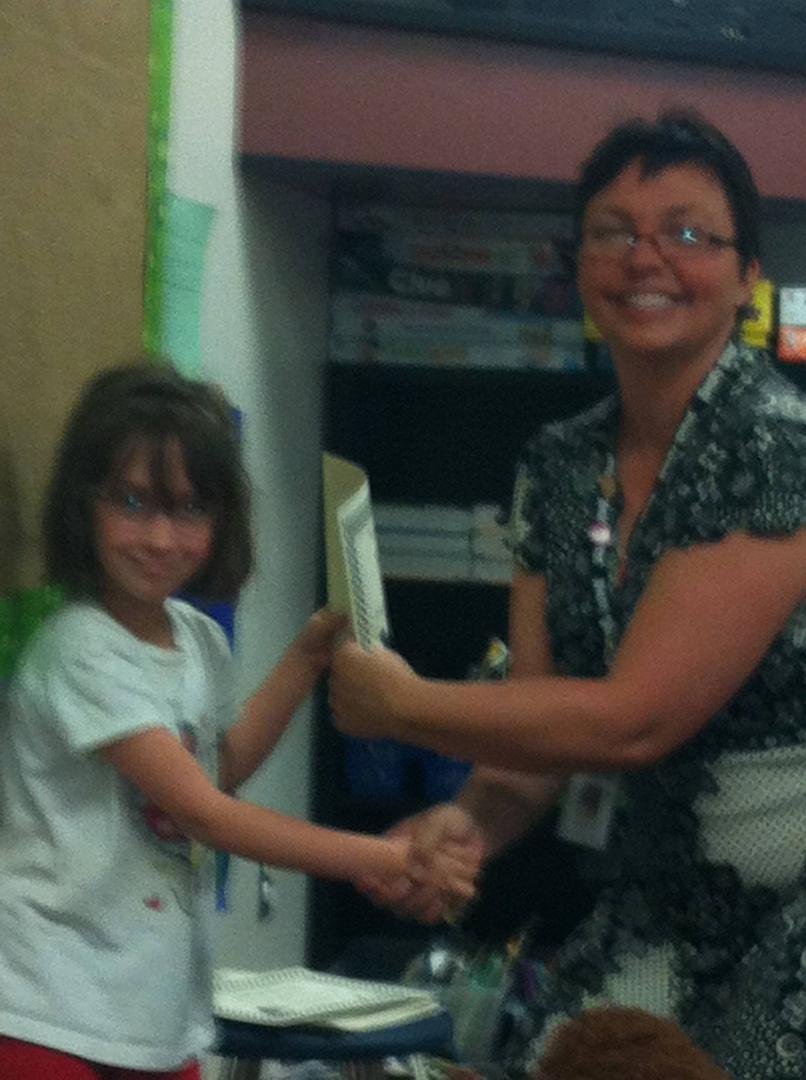 Today was Tova's last day of 2nd grade. At the award ceremony, she received an award for the best smile and the most giggles. The teacher also said she is a very happy child and every day she has a smile, and she will go fa