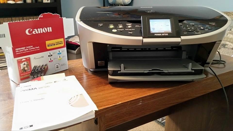 Canon Pixma MP500 color printer with new cartridges and booklet. Like new condition. Great for students, home office. Must sell, downsizing. Asking $50 or OBO. Located Piqua.