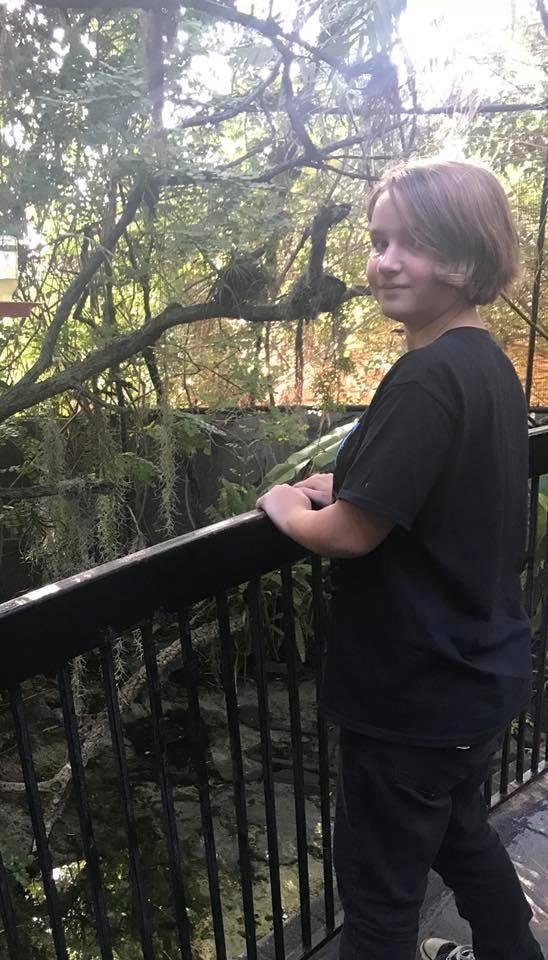 Our granddaughter, in the humming bird exhibit.