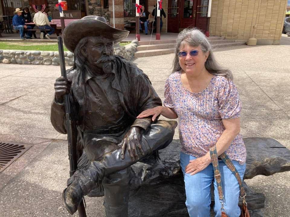 Shelia and Buffalo Bill sitting together outside the Hotel Irma at Cody, Wyoming. Enjoyed a great Mother’s Day lunch there a few minutes earlier.