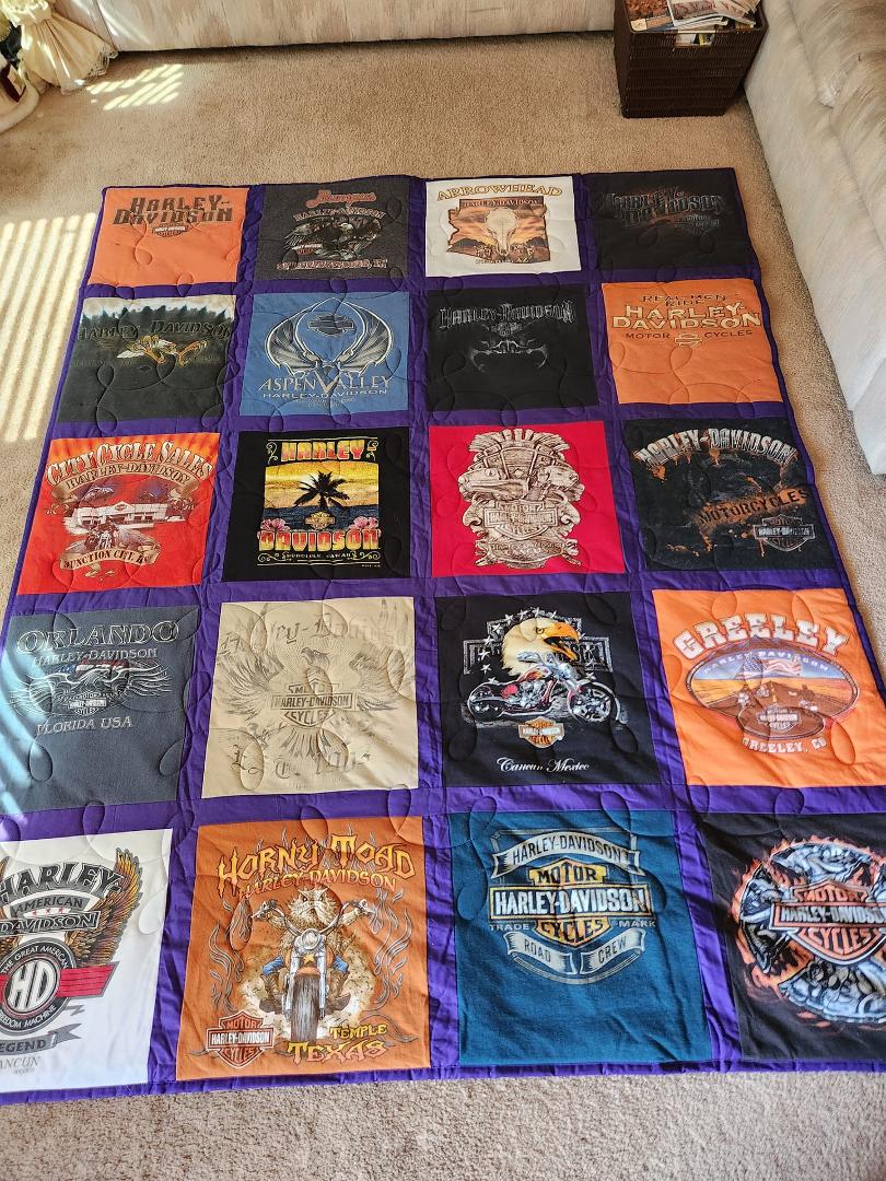 Had a t-shirt quilt made with some of Hank's favorite Harley shirts. It is perfect to cuddle up in watching our favorite shows in the family room.