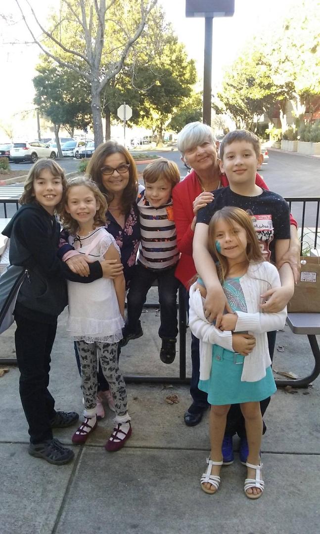 Two happy grandmothers with grandkids