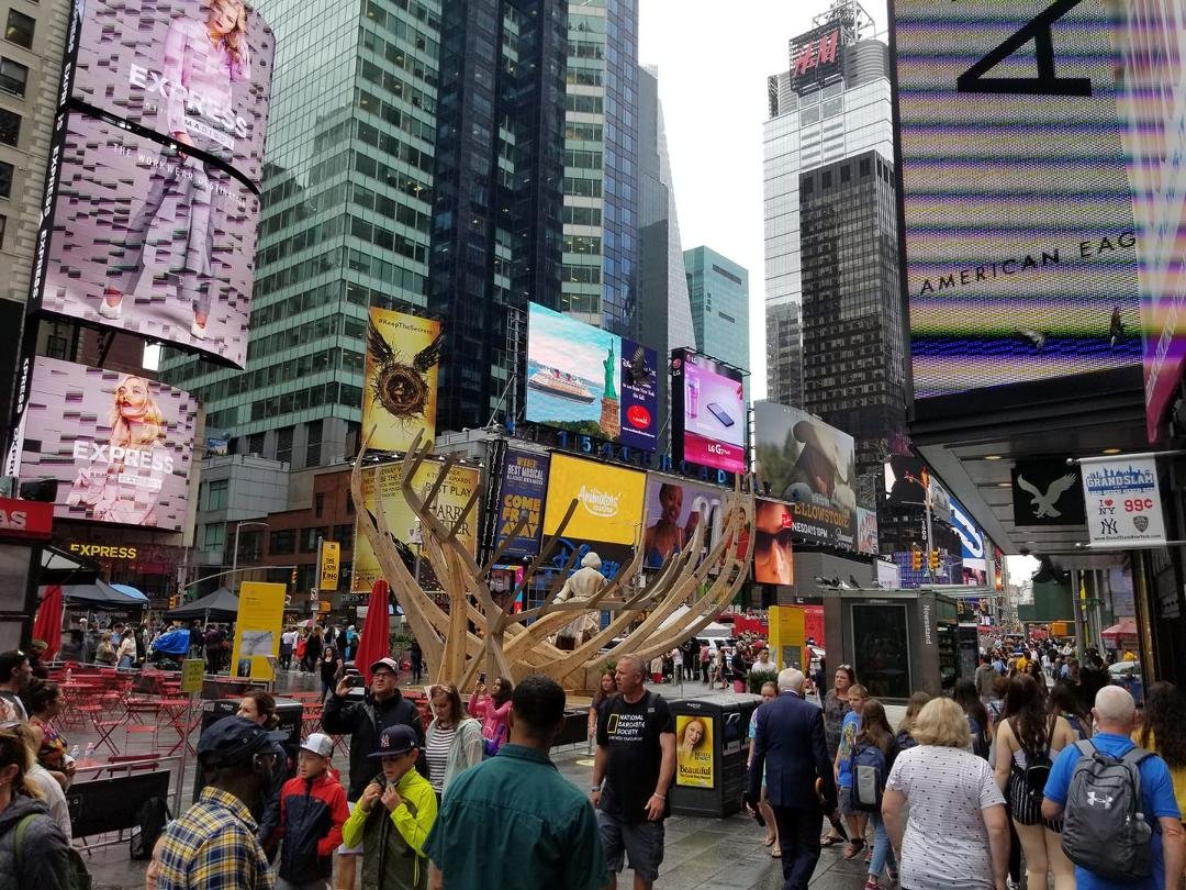 Times square. Crazy amount of people even early in the day and raining.
