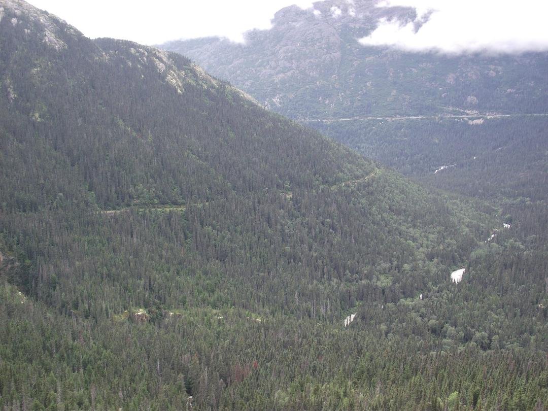 The roadway in the distance and our train track coming around the mountain on the left.