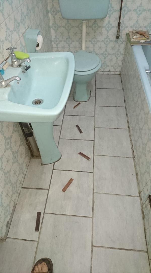 Bathroom tiling completed.