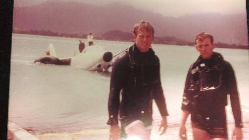 Ship's divers from USS TAKELMA (ATF-113) GREG HARRIS and JOE MCINTOSH after raising a crashed recon jet in Kaneohe Bay, Hawaii.
