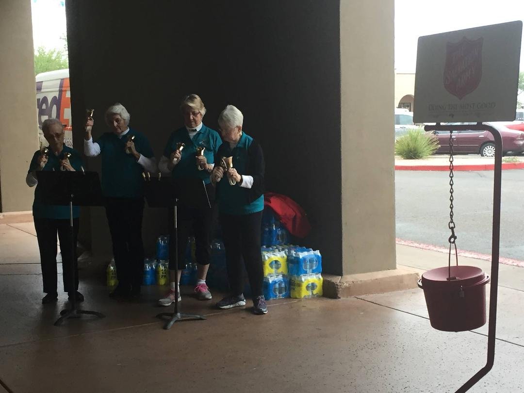 A quartet of ringers from the Canyon Carillon of Gold Canyon United Methodist Church, Gold Canyon, AZ helping the Salvation Army ringer at Bashas' Grocery Store.