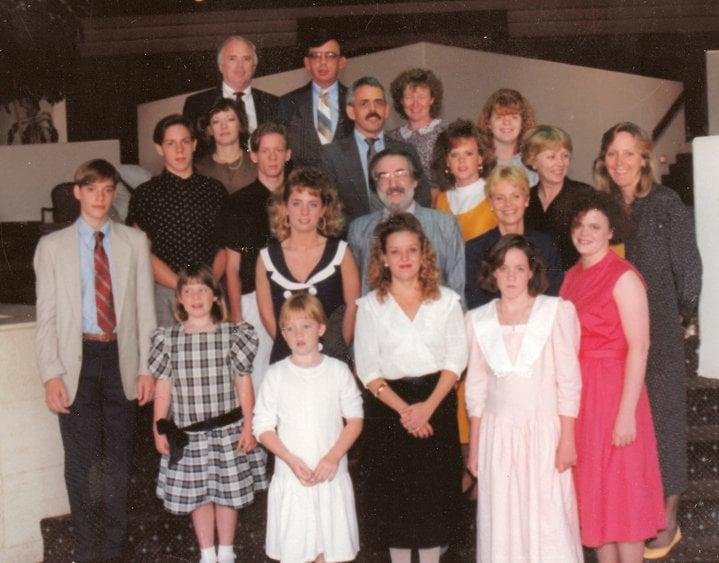 I think this picture was taken after a lunch we had with most of the family that was there. That is me, John, and Robert at the top center of the picture. That would have been in 1989.