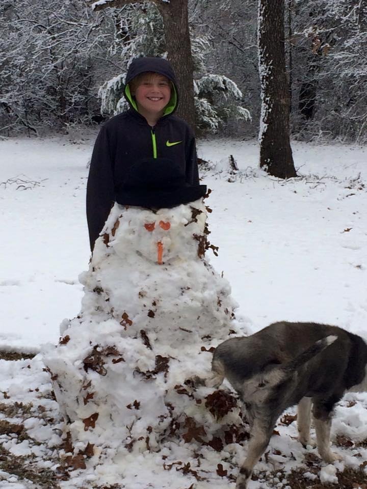 My grandson, Ellis, had so much fun building a snowman this morning.  My dog Freddie loved the snowman too.  Classic!!!!