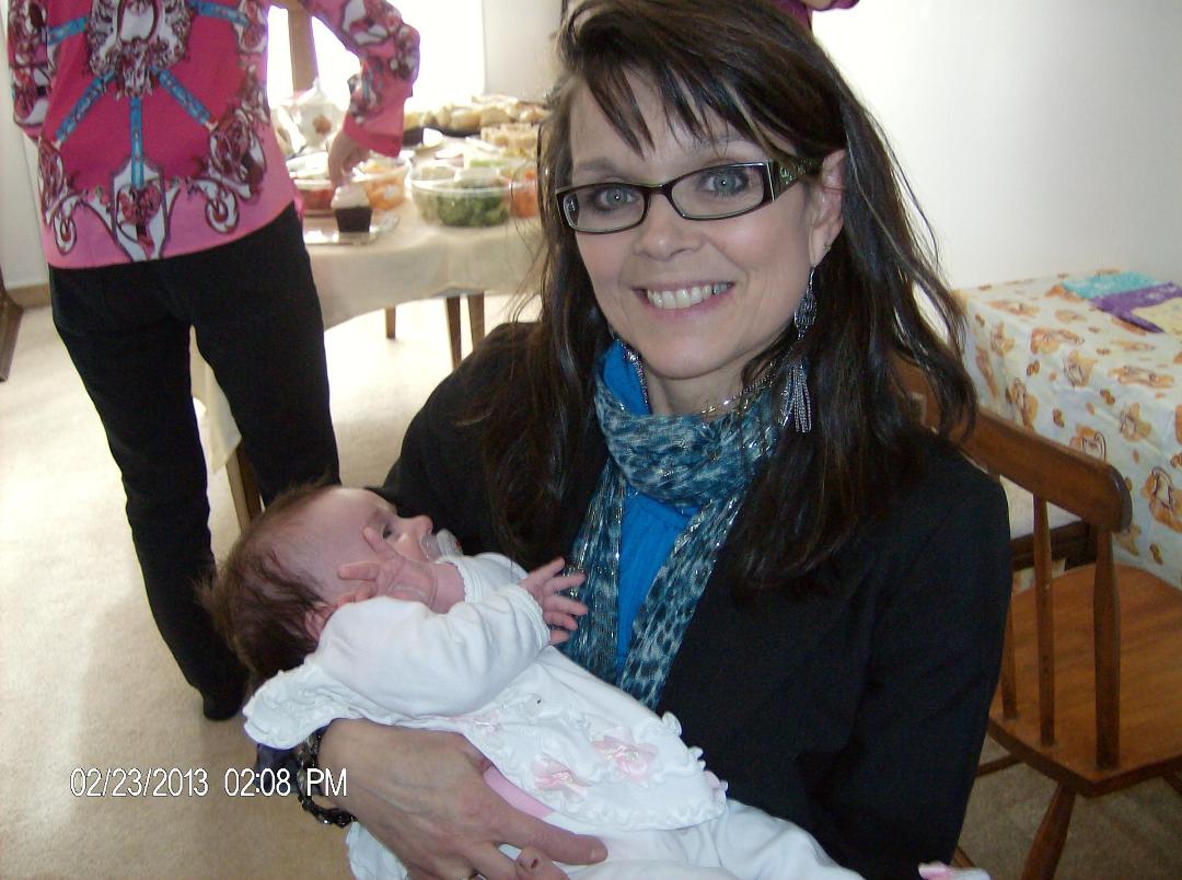 Kathy Pope holding Olivia at Katie Maskell's Baby Shower.