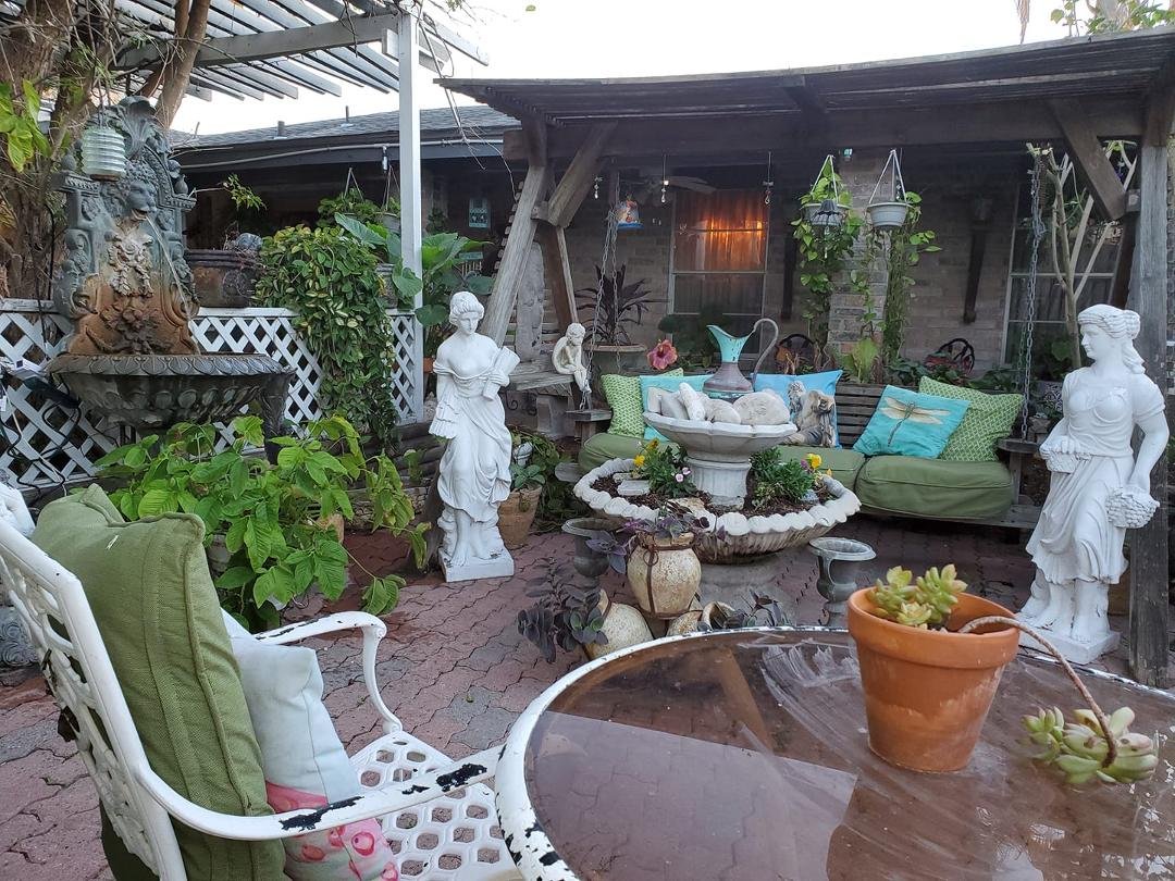 Just chillin' in our courtyard...looking at the magnificent hibiscus bloom