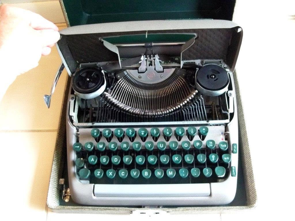 Identical to my mom's Smith-Corona "portable" typewriter (shown here in its travel case).