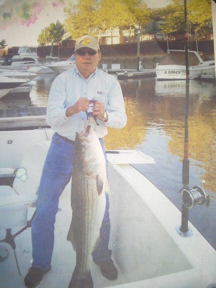 Me and a nice 28 lb striper on back of my boat at breakwater key marina in stratford ct.