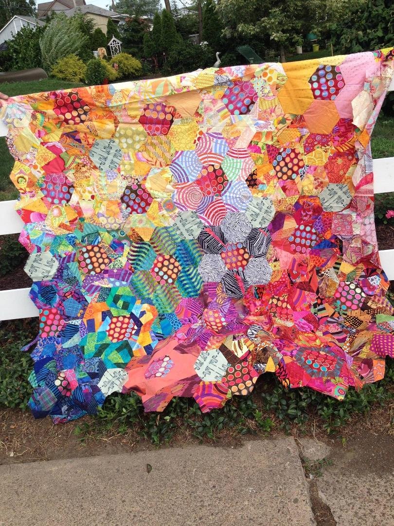 Here's a photo of a quilt from a class with Victoria Findlay Wolfe last December. Used hexagons and "made". I am not pleased with the layout, although I loved the process. Too difficult to tell this is supposed to repres