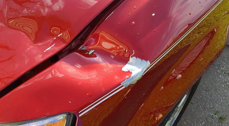 Dent on front end of our van....we also found out that we can't open drivers door.
