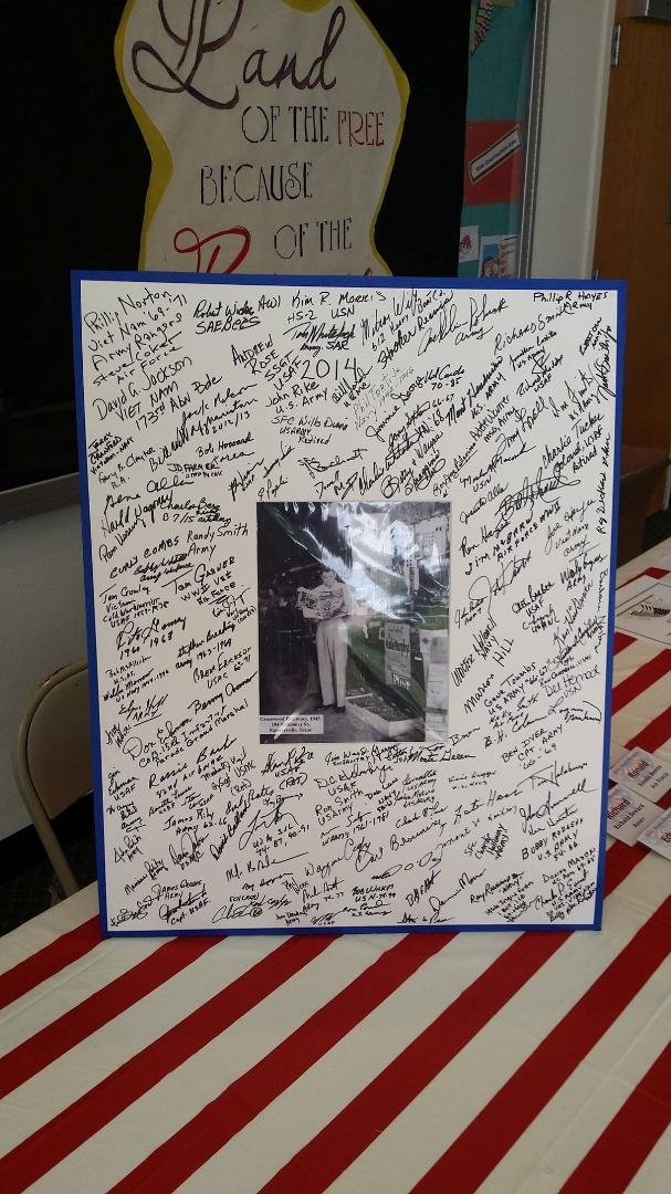 Picture of Audie Murphy signed by veterans attending the 2014 Audie Murphy Day in Farmersville, Texas.