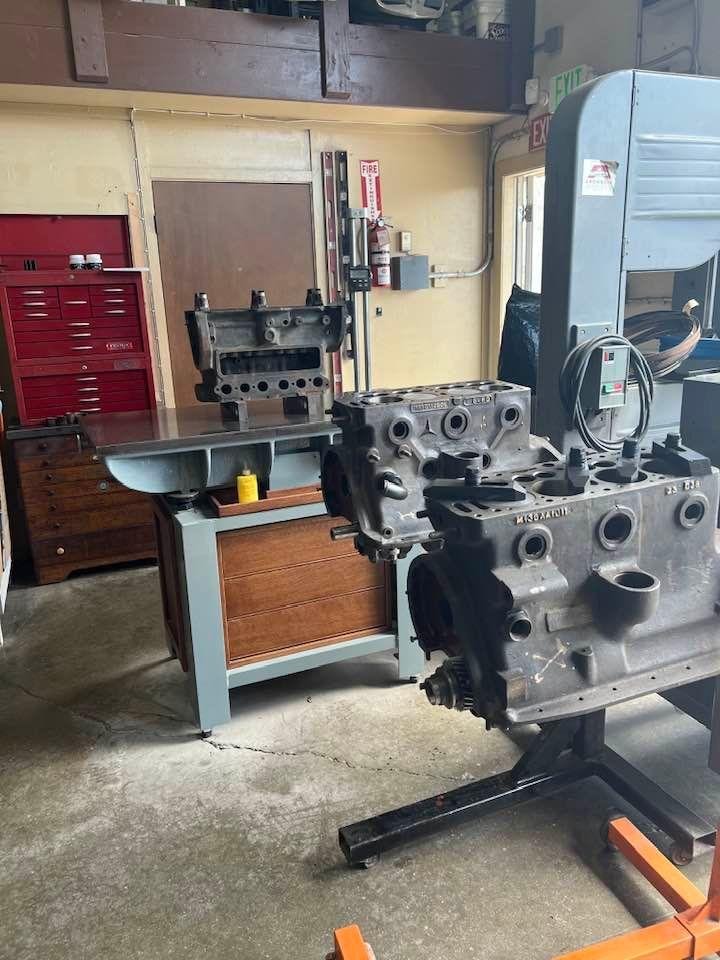 Three Mercedes engines in the shop. I need to make two from all the parts.