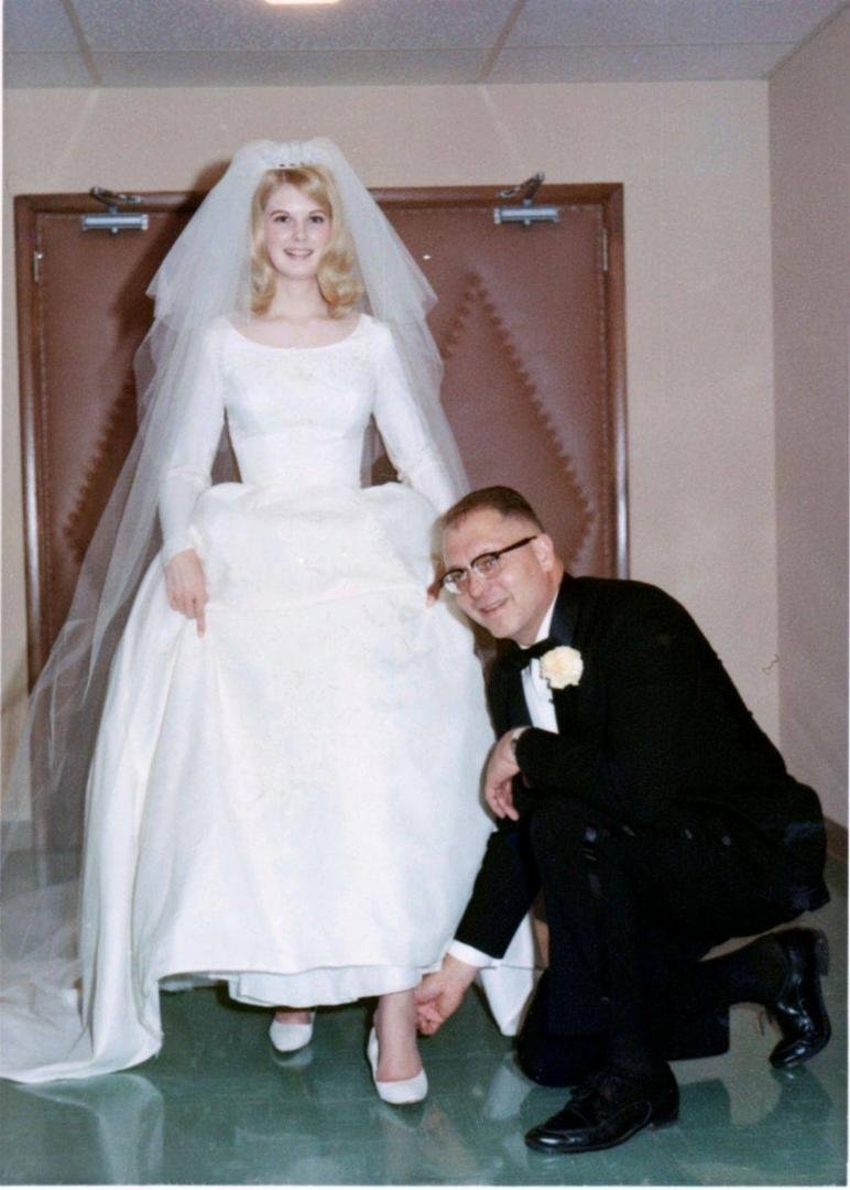 Dad putting a lucky penny in my shoe on my wedding day.