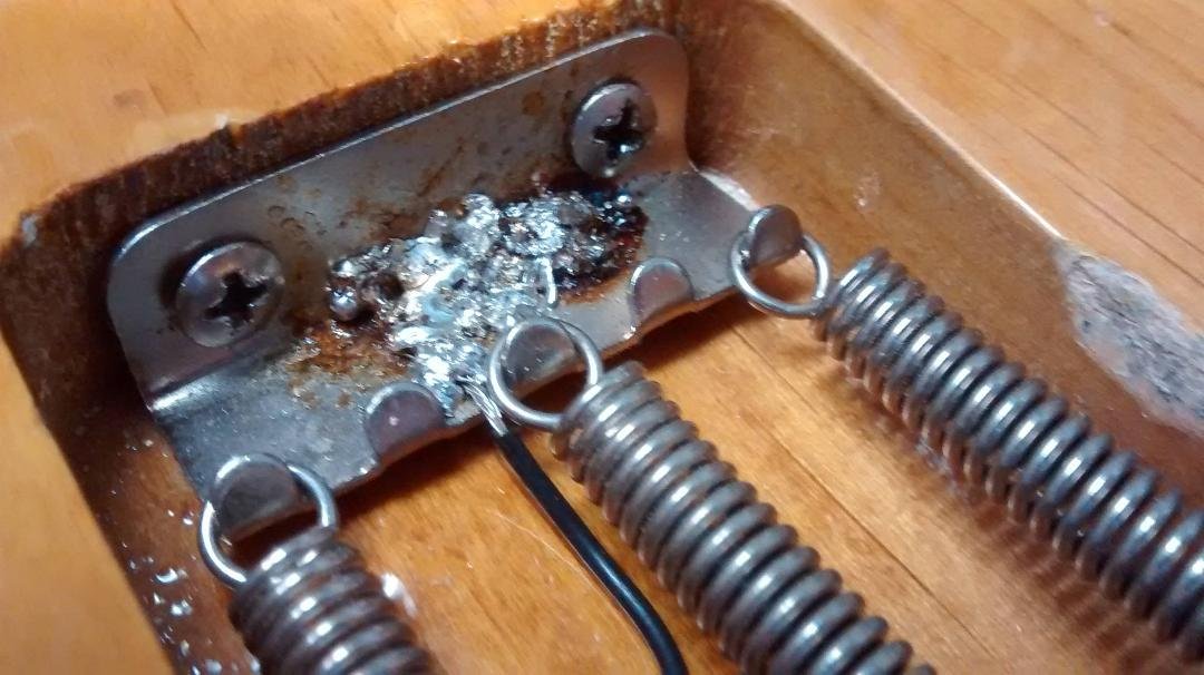 When Buying a used stratocaster be sure to always take advantage of the inspection plate by removing it and inspecting inside. as you can see. this has the worlds worst solding done (i'm afraid to look under the front cover