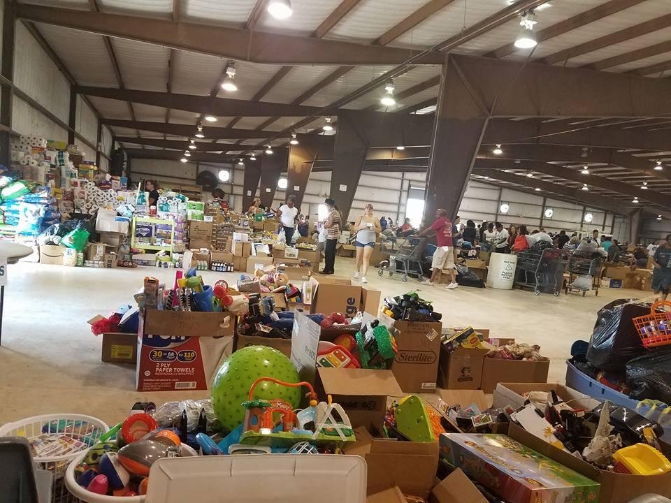 Here helping out at the local hurricane Harvey donation center. With my wife.