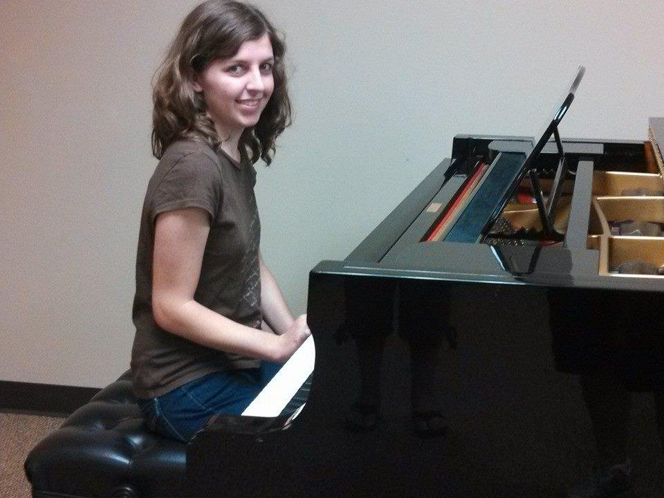 Katie Bossert playing on the piano Elton John played on